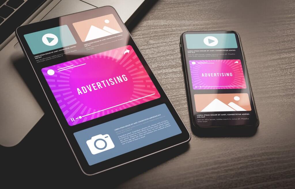 Tablet and mobile phone displaying ads